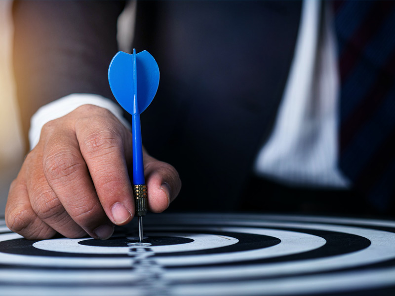 Position-With-Precision man with arrow positioned in center of target