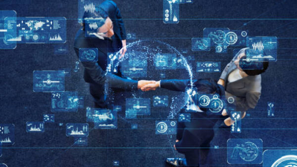 Two people shaking hands as blue pixel images float around them