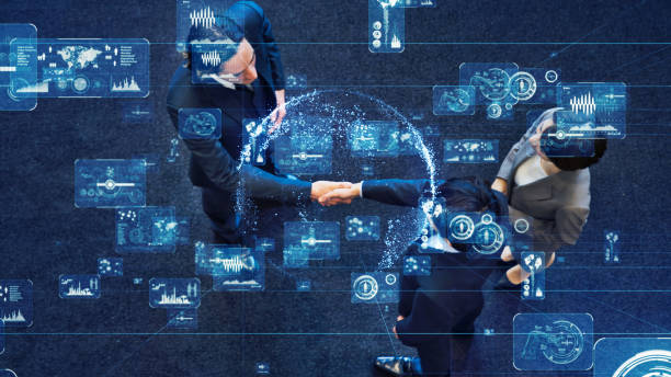 referral blog Two people shaking hands as blue pixel images float around them