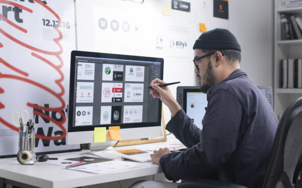 Asian Graphic designer working in office. Artist Creative Designer Illustrator Graphic Skill Concept. Man at computer viewing graphic designs