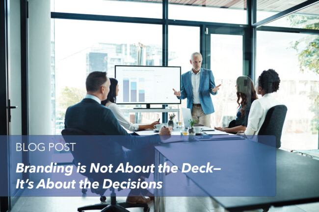 brand-deck-decisions–cover man giving presentation to team members in conference room